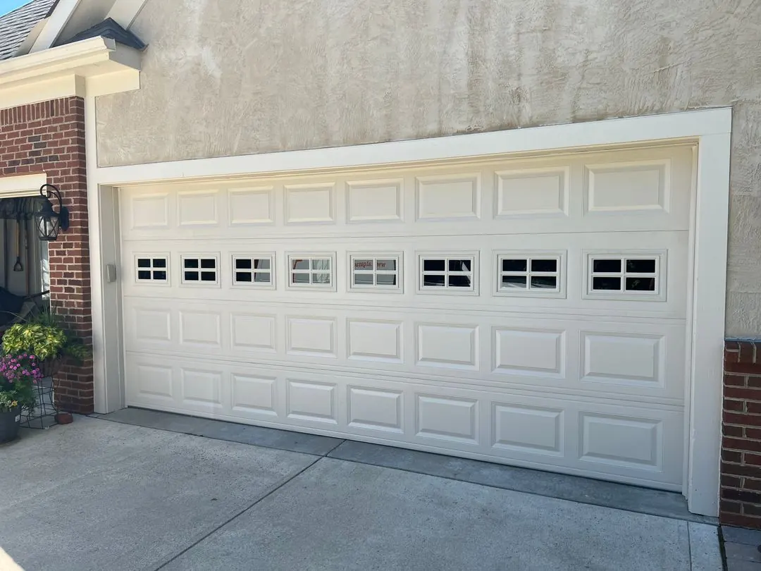 White raised-panel door with small windows