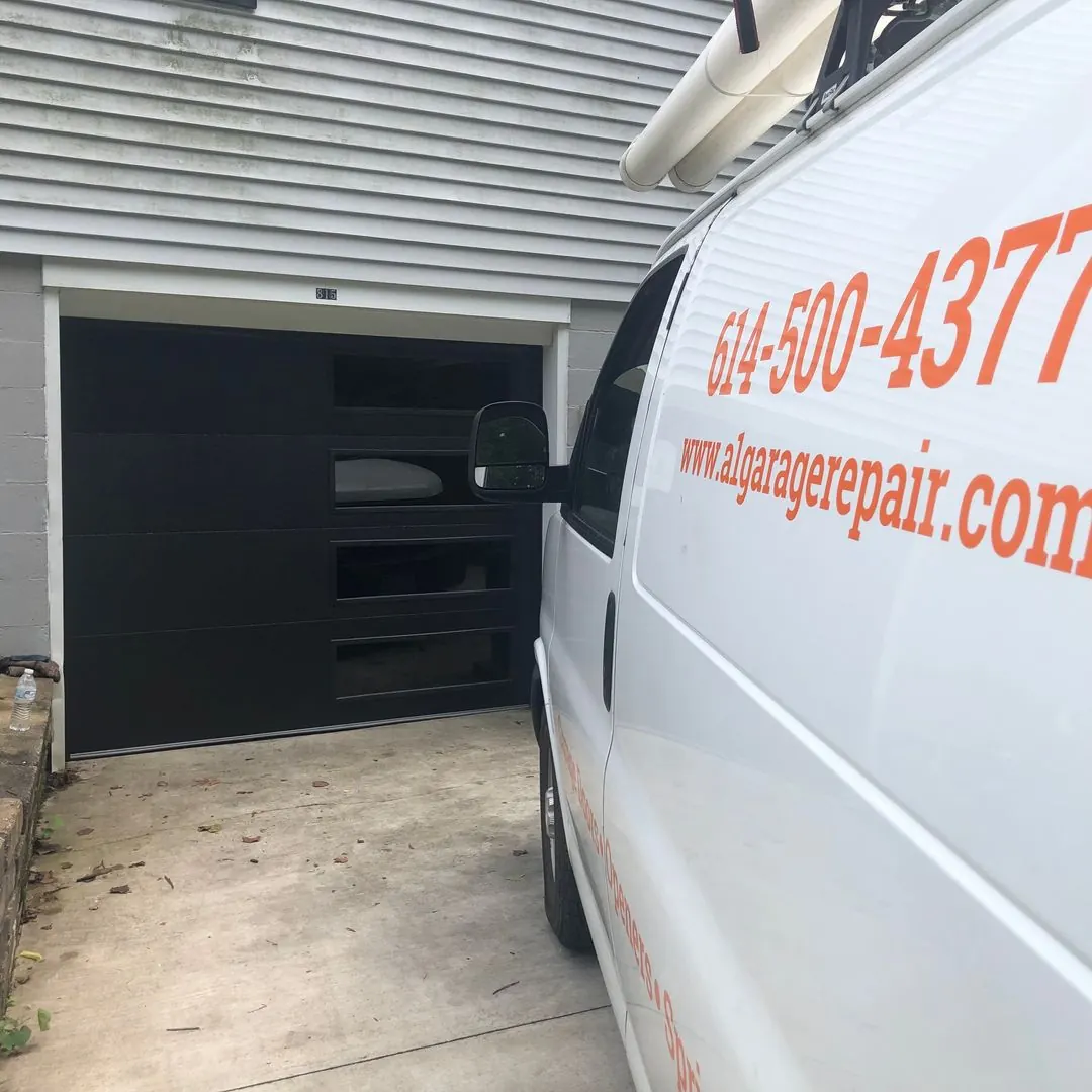 Black modern door with a column of windows