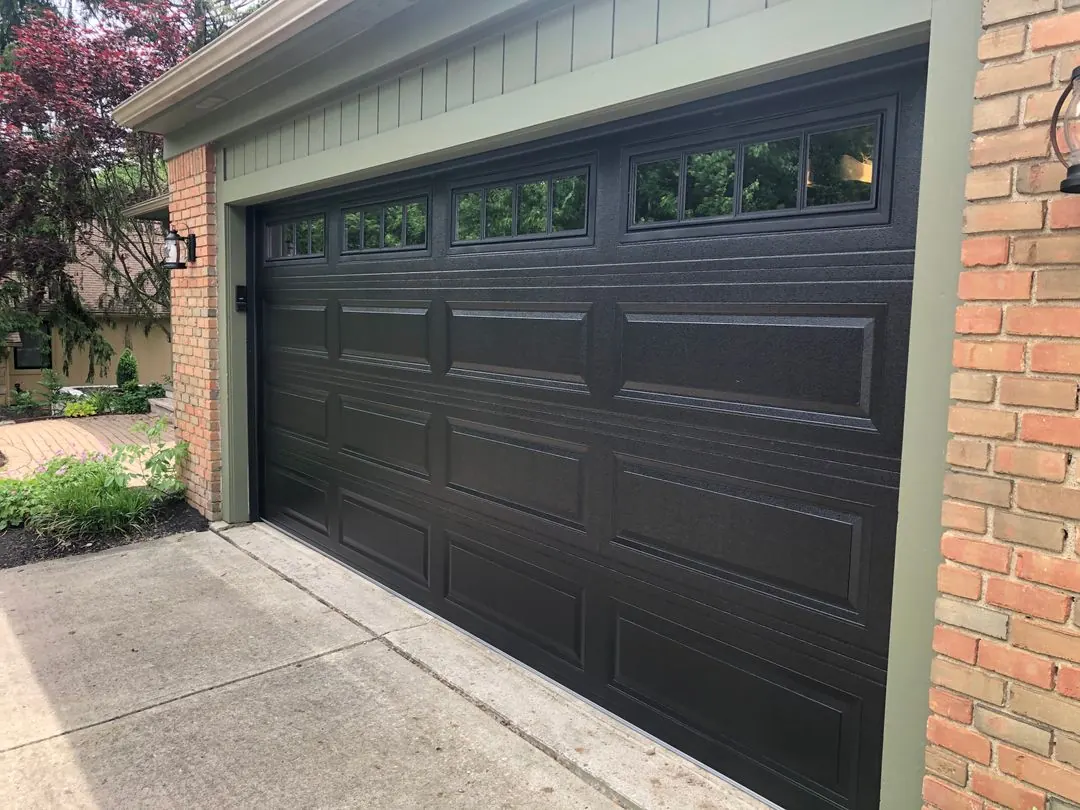 Dark raised-panel door with top windows